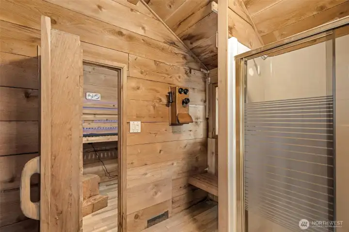 View of outer sauna looking into the "sweat area" with benches to sit or lay down on. The shower to the right is not currently hooked up to water- View of outer sauna looking into the "sweat area" with benches to sit or lay down on. The shower to the right is not currently hooked up to water-