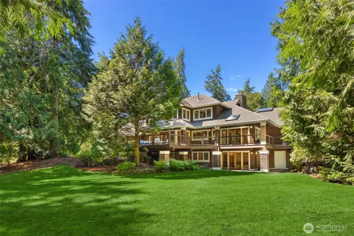 1.4 acres of lawns, new decks, gardens, a waterfall and pond! Raised veggie beds and privacy!