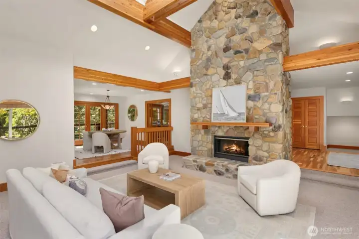 East living room with formal dining to the left and entryway to the right. The entire home is heated and cooled with two furnaces and two heat pumps.