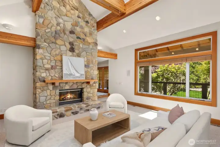 East living room, view to the front door and garden view window. The home is served by a on-demand generator.