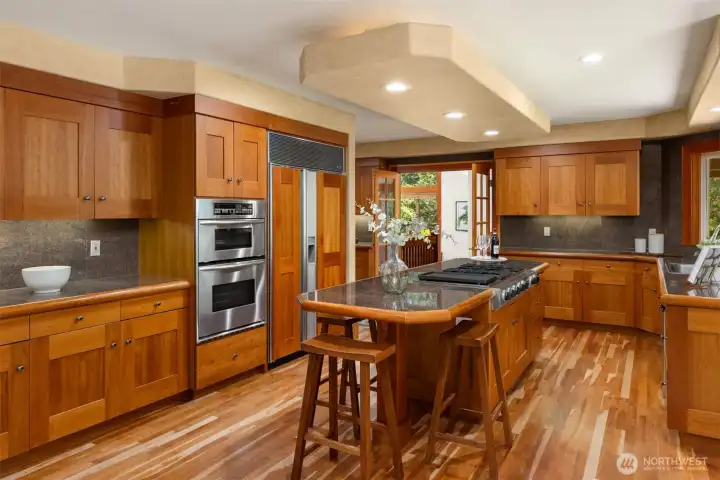 View to the kitchen breakfast counter. East living room and dining room straight on.
