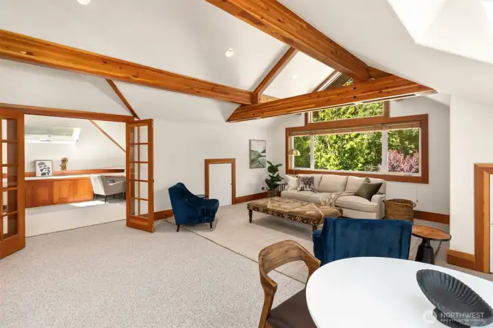 The upper family room with adjacent office.