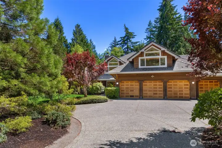 The four bay, finished garage has over 1,150sf of work and storage space. The aggregate driveway way offers parking for over ten cars with the convenience of the circular driveway.