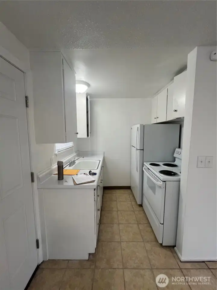 Interior file photos prior to rental of 1642 kitchen