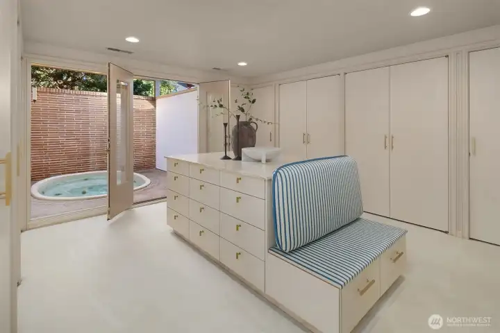 The primary suite sizable walk-in closet/dressing room opens onto a outdoor/covered hot tub area. The primary suite sizable walk-in closet/dressing room opens onto a outdoor/covered hot tub area.