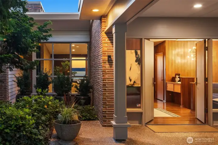 The front door with its double doors and aggregate flooring. The front door with its double doors and aggregate flooring.