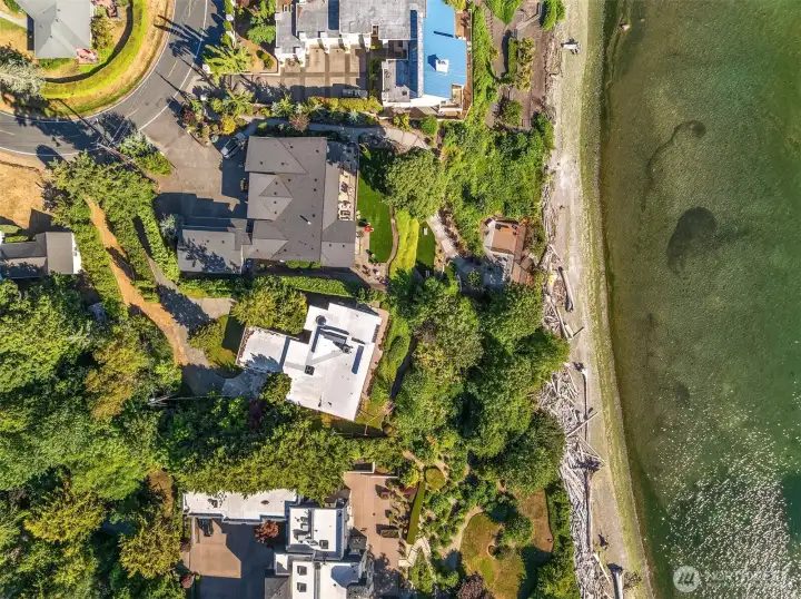 Aerial view showcasing the privacy of the home centered on its half-acre property, a rare feature for any waterfront home locally. Aerial view showcasing the privacy of the home centered on its half-acre property, a rare feature for any waterfront home locally.