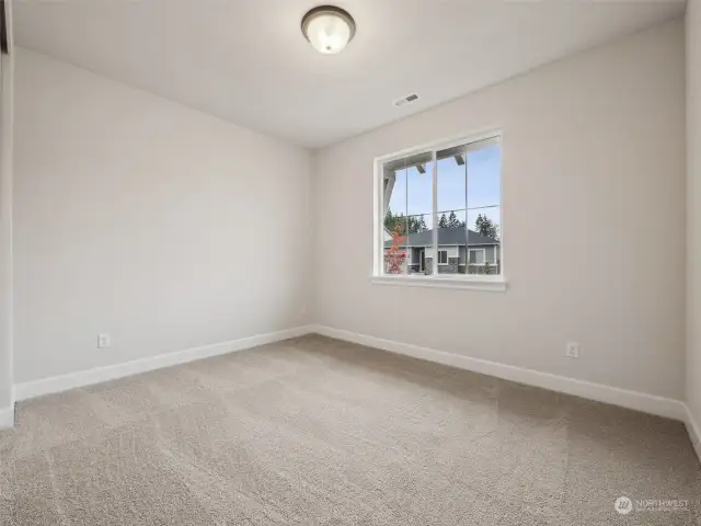 Main floor bedroom. Photos are of the actual home.