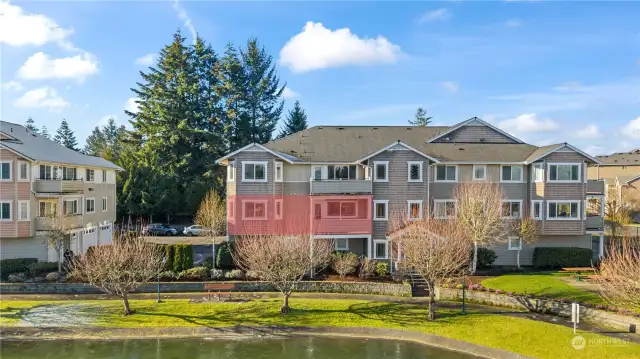 Unit overlooks the pond and offers peaceful views from spacious covered deck, living room, and primary suite.