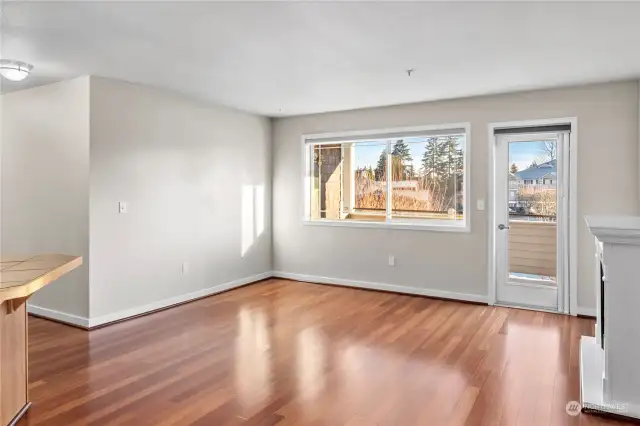 Open concept living room with beautiful electric fireplace and oversized covered deck.