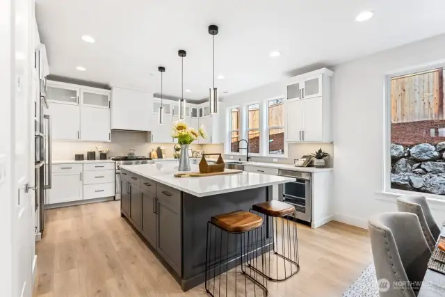 Gorgeous chef's kitchen with quartz counters, huge island, soft close drawer/cabinets with pull out shelves.