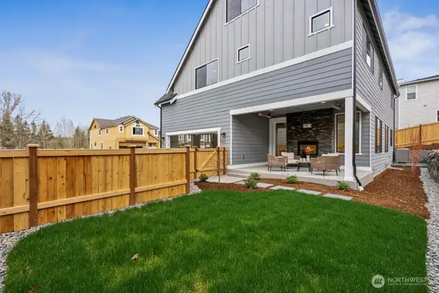 Private, low-Maintenance yard. The outdoor living can be enjoyed year around with fireplace and overhead heat lamps.