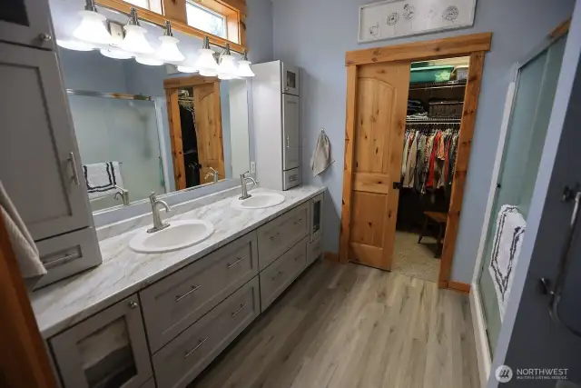 Master bath with double sinks and large walk-in closet
