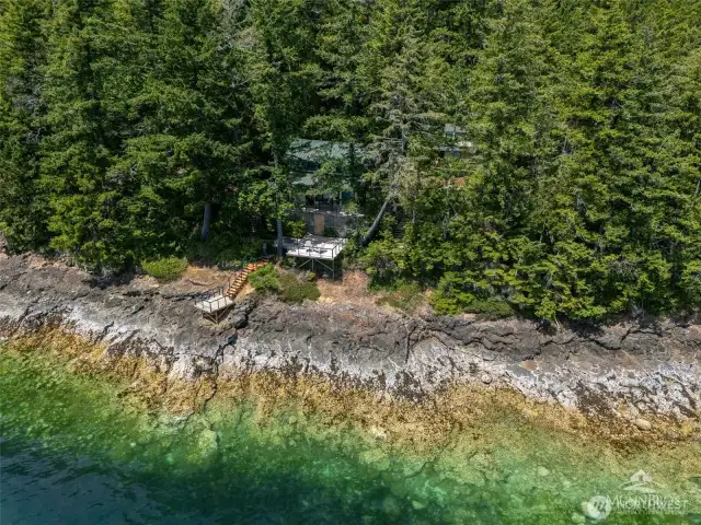 Home is tucked away in the trees.
