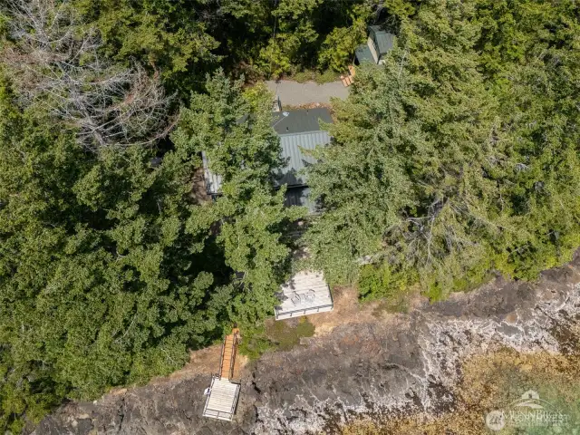 Aerial looking down on the home and waterfront.