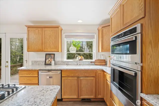 Brand new cooktop and window view to the open backyard