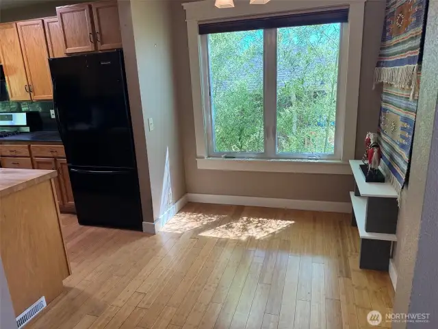 eating nook area, kitchen to left, 3rd bath to the right