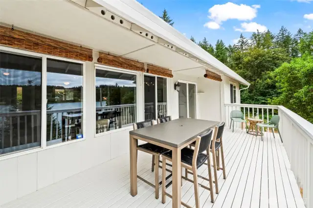 Spacious back deck with views of Burley Lagoon and forested backdrop