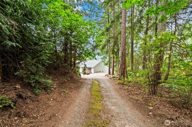 Long driveway offers privacy from the road and space to expand