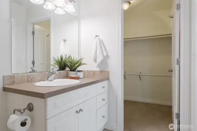 Walk in closet just off the primary bathroom