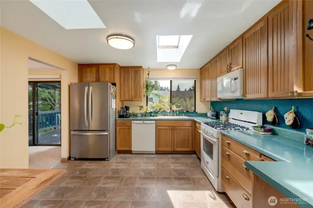 Kitchen w/ big window in front of sink for great natural lighting.