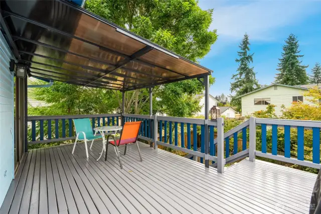 Freshly painted deck with covered area right off of the dining room.