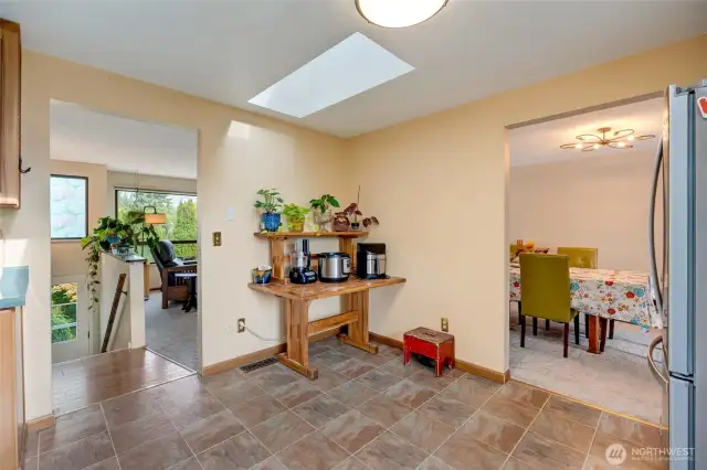 Looking out to dinning room and living room from upper level kitchen