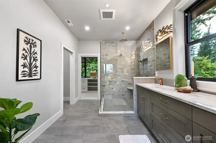 Spacious 2nd primary ensuite layout with second laundry area.