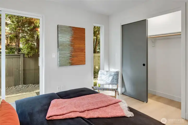 Expansive vertical windows & doors, blurring the line between indoors & nature. Generous closet space provides ample storage.