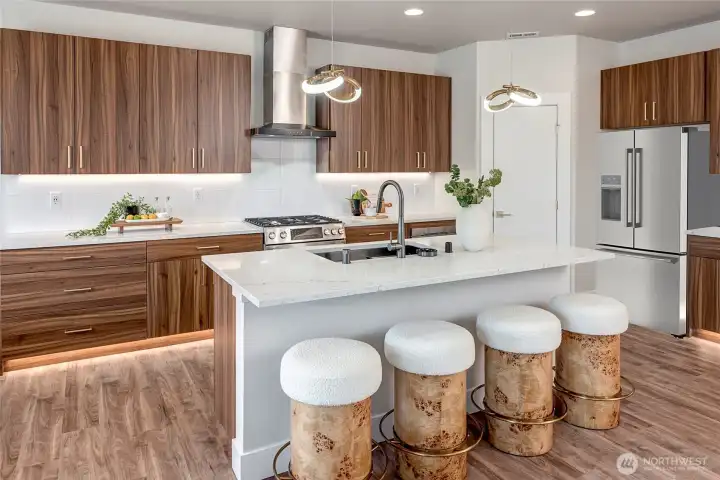 Gas cooking range with hood vent (model home lot 1A, colors may vary)