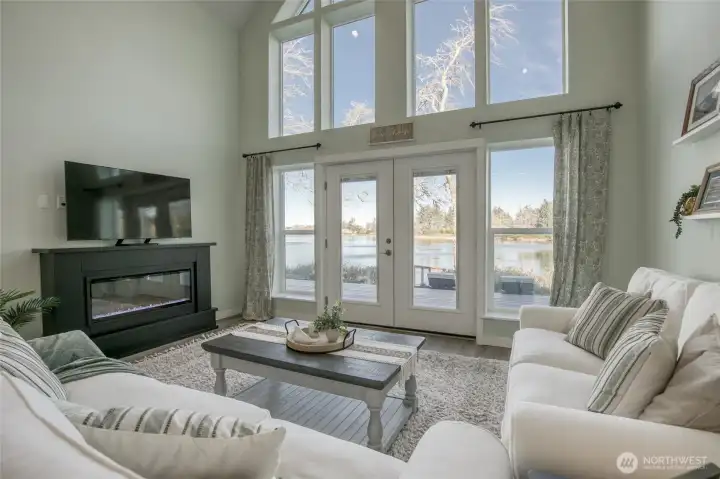Bright living room with wifi-enabled electric fireplace