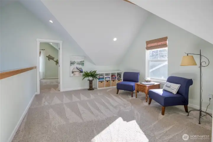 Spacious loft is the perfect place for guests to hang out or sit and relax with a good book