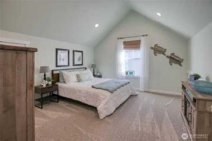Upstairs guest room with vaulted ceiling