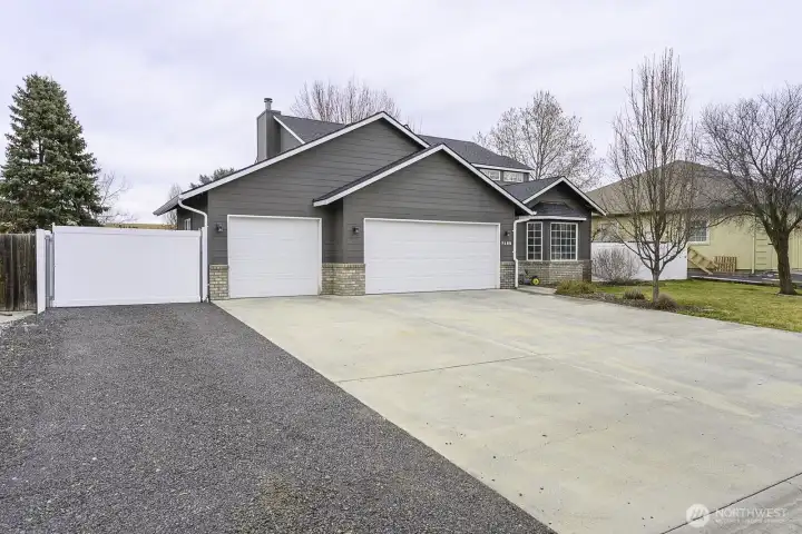 3 car garage + gravel slab means you never have to worry about running out of parking space!