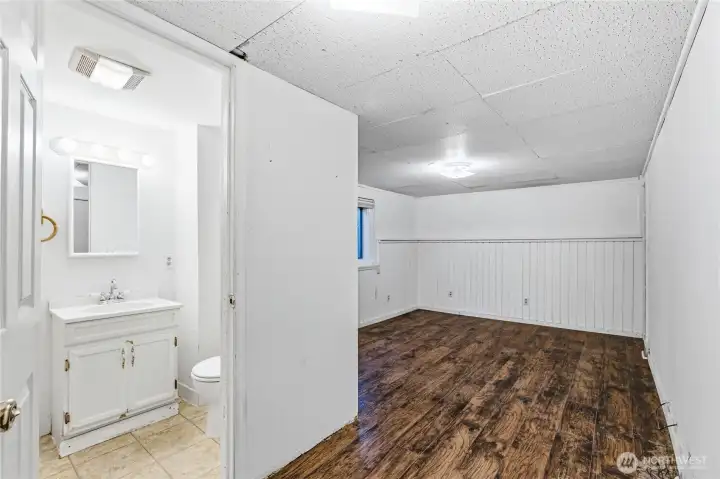 Generously sized primary bedroom featuring a rare ¾ ensuite bath—a major value-add for a home of this era. Ready for your personal touch to create a private retreat.