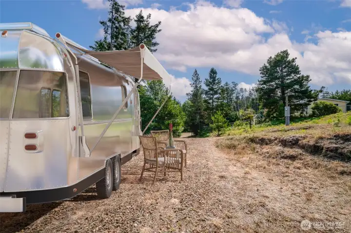 Virtually staged-RV parking area on site with power and septic access