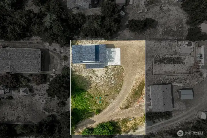 Approximate lot area from above-lower corner is RV parking area with power and septic access