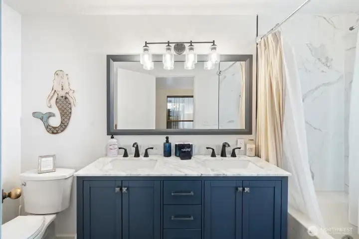 Full bathroom off the primary suite.