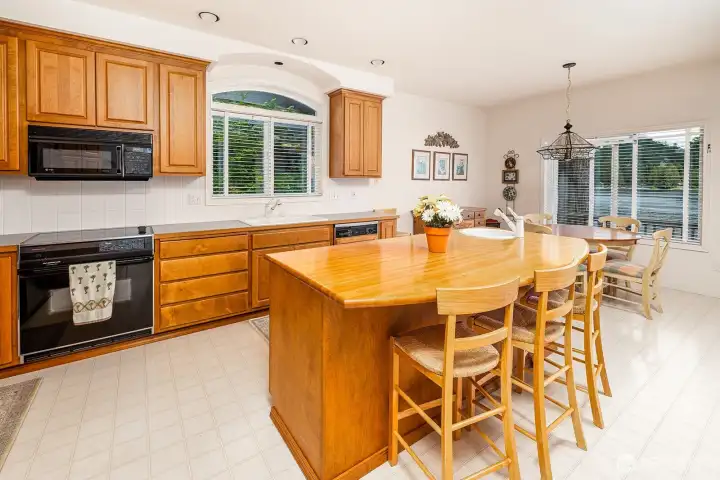 Island with seating is the perfect spot for morning chats over coffee.