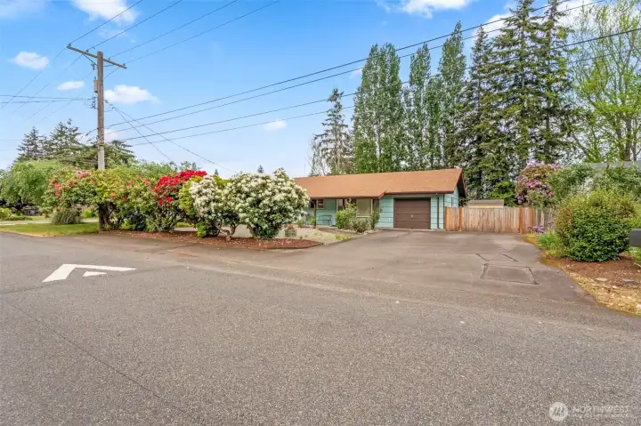 Extra parking along the road and huge parking spaces in front of the garage and RV parking behind the wide open gate
