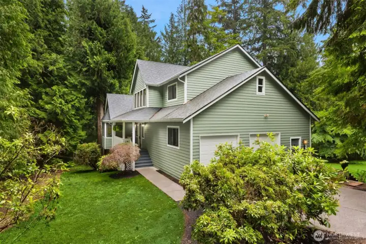 This is the main entrance to the home with a small side-yard on the northern side of the property. (the lawn has been photoshopped).
