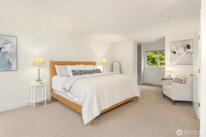 Primary bedroom with walk-in closets at the end of the room.