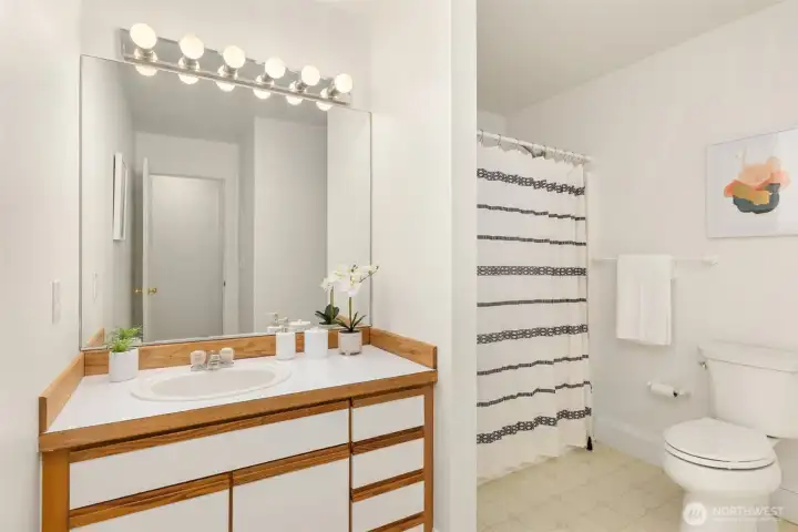 Full bath serves both guest rooms.