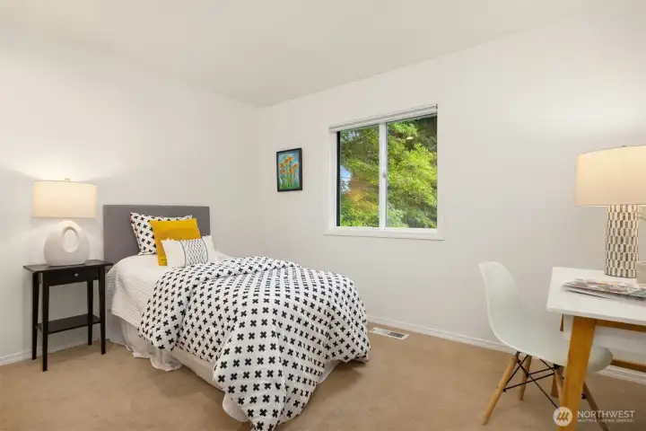 2nd upper level guest room with south-facing window.