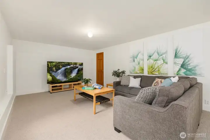 The TV conveys with the sale.  Note the little wine storage closet on the right.