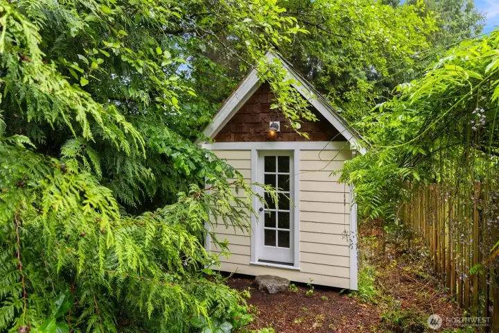 Follow a small trail behind the fence to this magical little cottage.  It's just delightful!