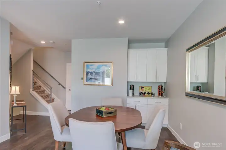 Dining with additional serving cabinets