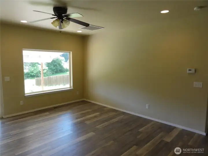 Living room off the kitchen. Slider opens to large and private back yard. Living room off the kitchen. Slider opens to large and private back yard.
