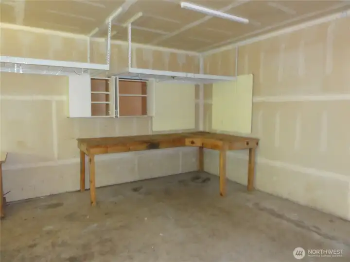 Huge garage with shop area. Huge garage with shop area.