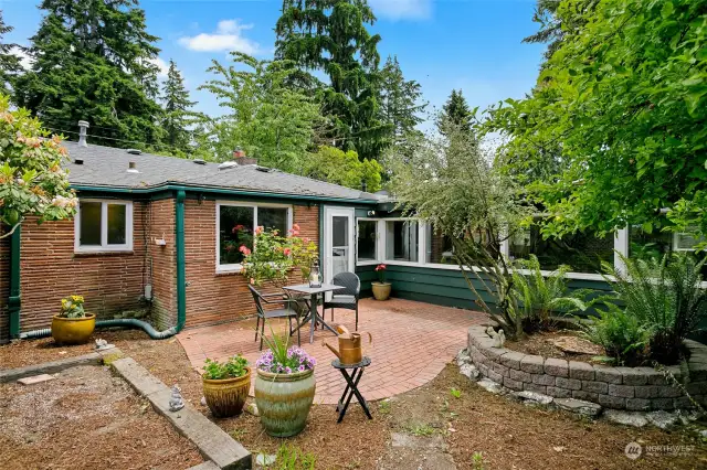 This lovely brick patio just off the kitchen is a delightful place to barbecue, entertain guests or just sit back on a cozy lawn chair and read a book while listening to the birds sing.